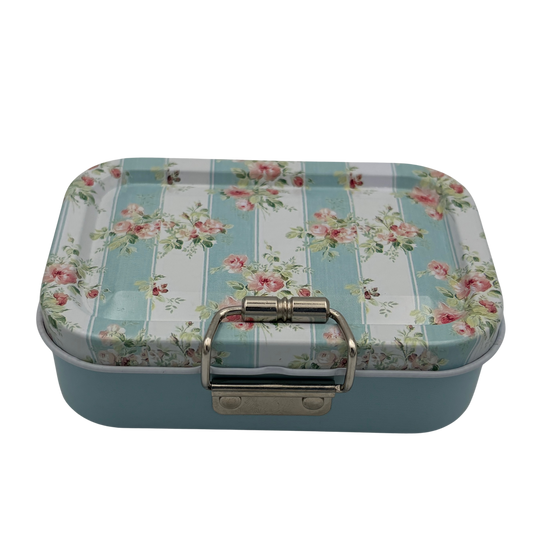 Rectangular tin box with floral and striped design on a white background