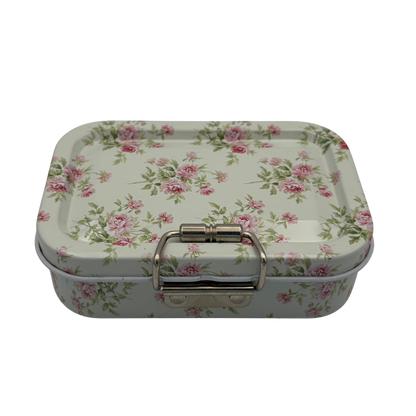 Floral-patterned metal box with a silver clasp on a white background
