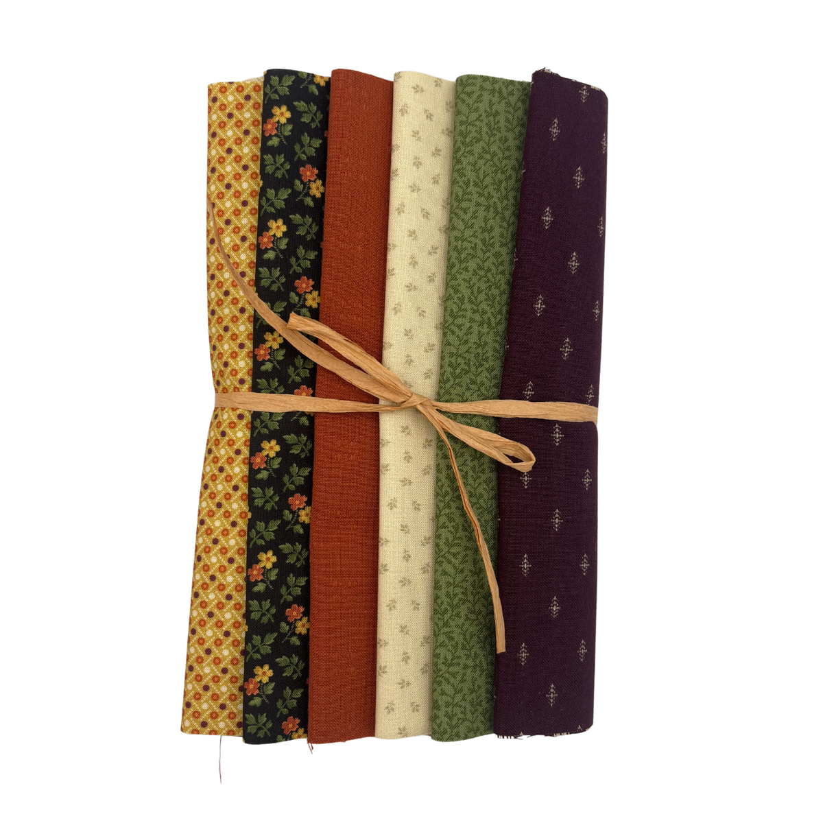 A bundle of six patterned fabric slices tied together with a natural twine string, displayed on a clean white background.