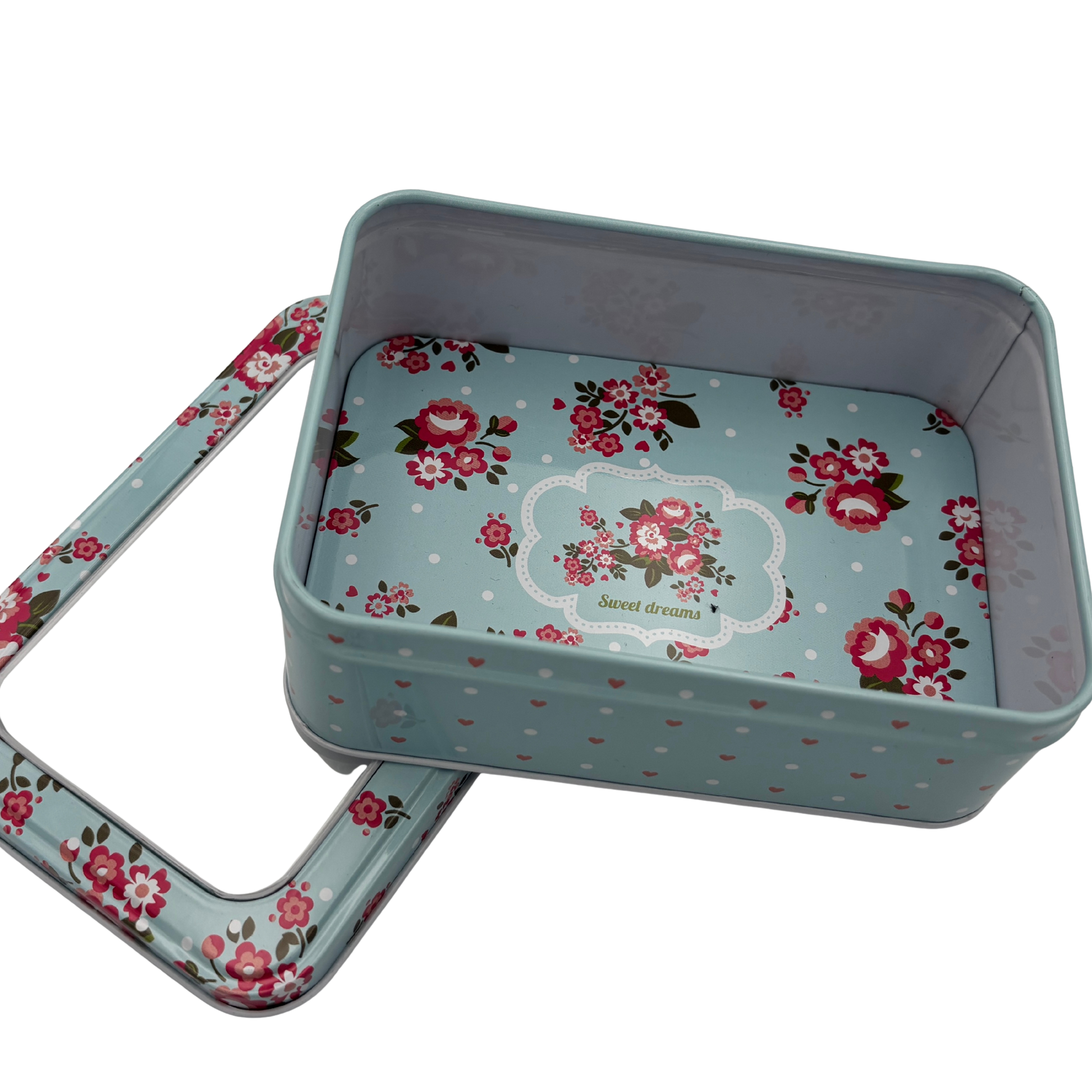 Floral-patterned metal tin with lid on a white background