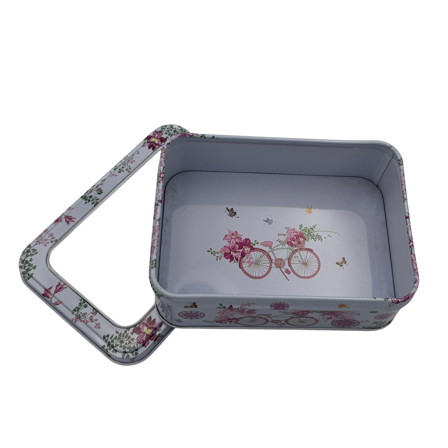 Floral-patterned metal tin with lid on a white background