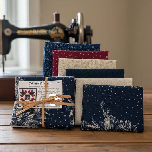 Collection of fabric swatches with various patterns on a wooden table