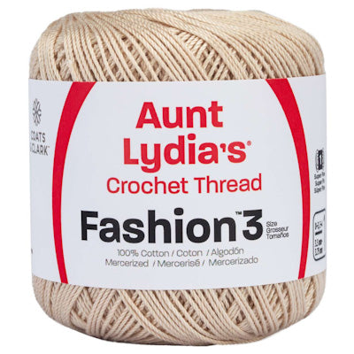 Ball of Aunt Lydia's Crochet Thread with beige yarn and white label