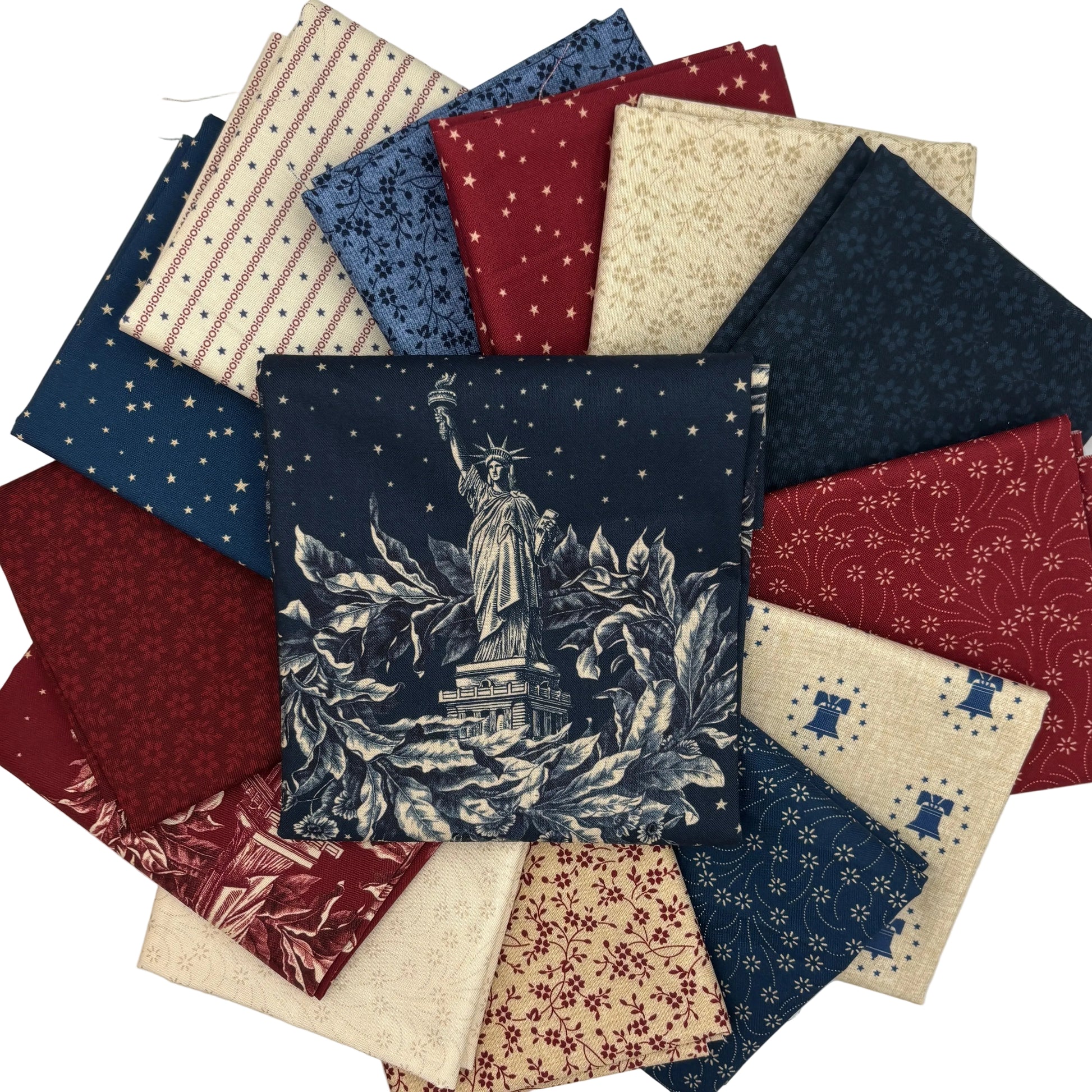 Collection of fabric swatches with various patterns and a prominent design of the Statue of Liberty.