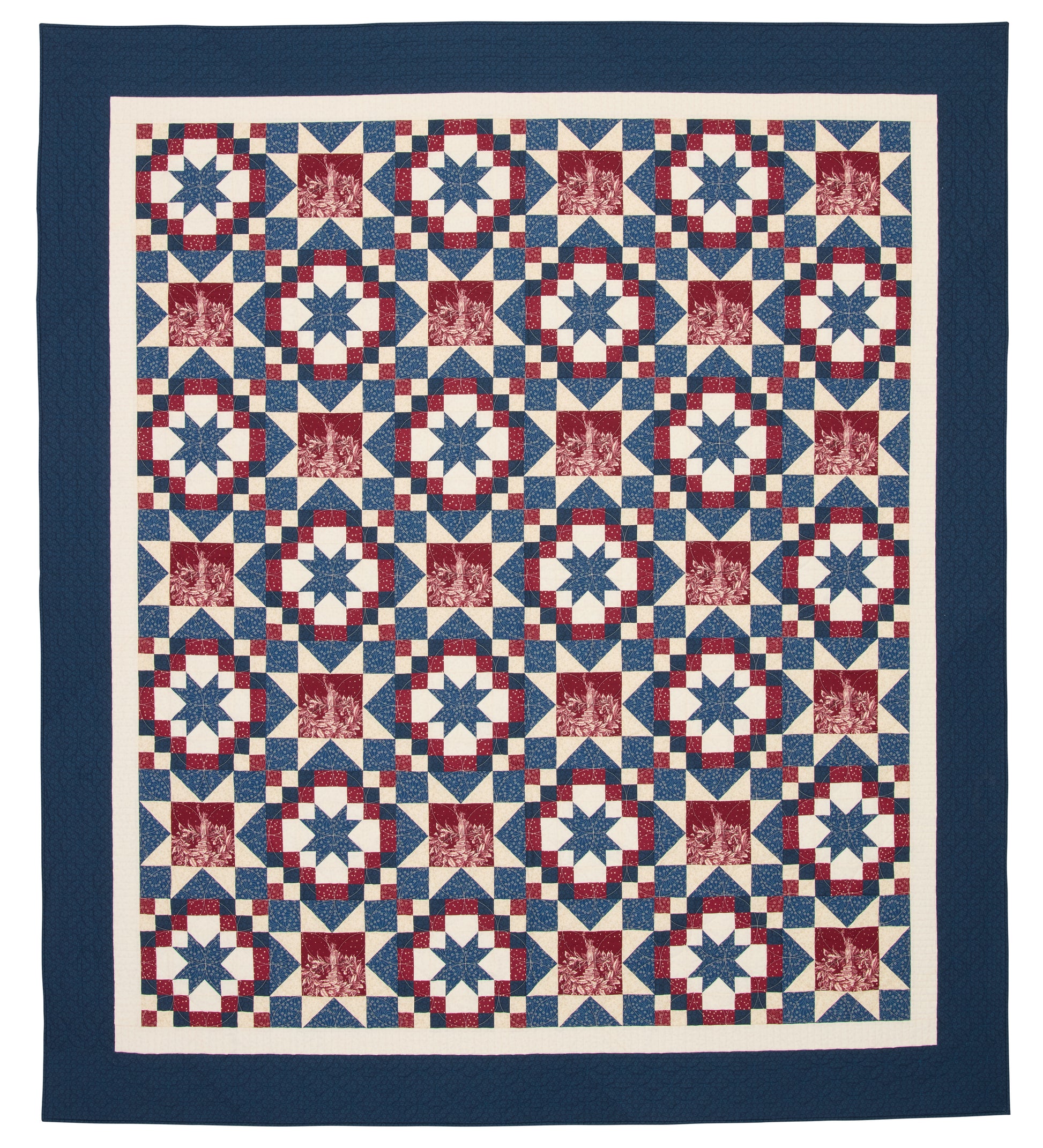 Quilt with a geometric pattern in red, white, and blue on a white background