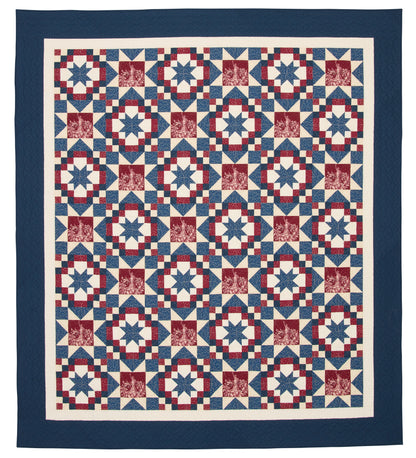 Quilt with a geometric pattern in red, white, and blue on a white background