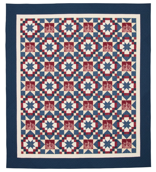 Quilt with a geometric pattern in red, white, and blue on a white background