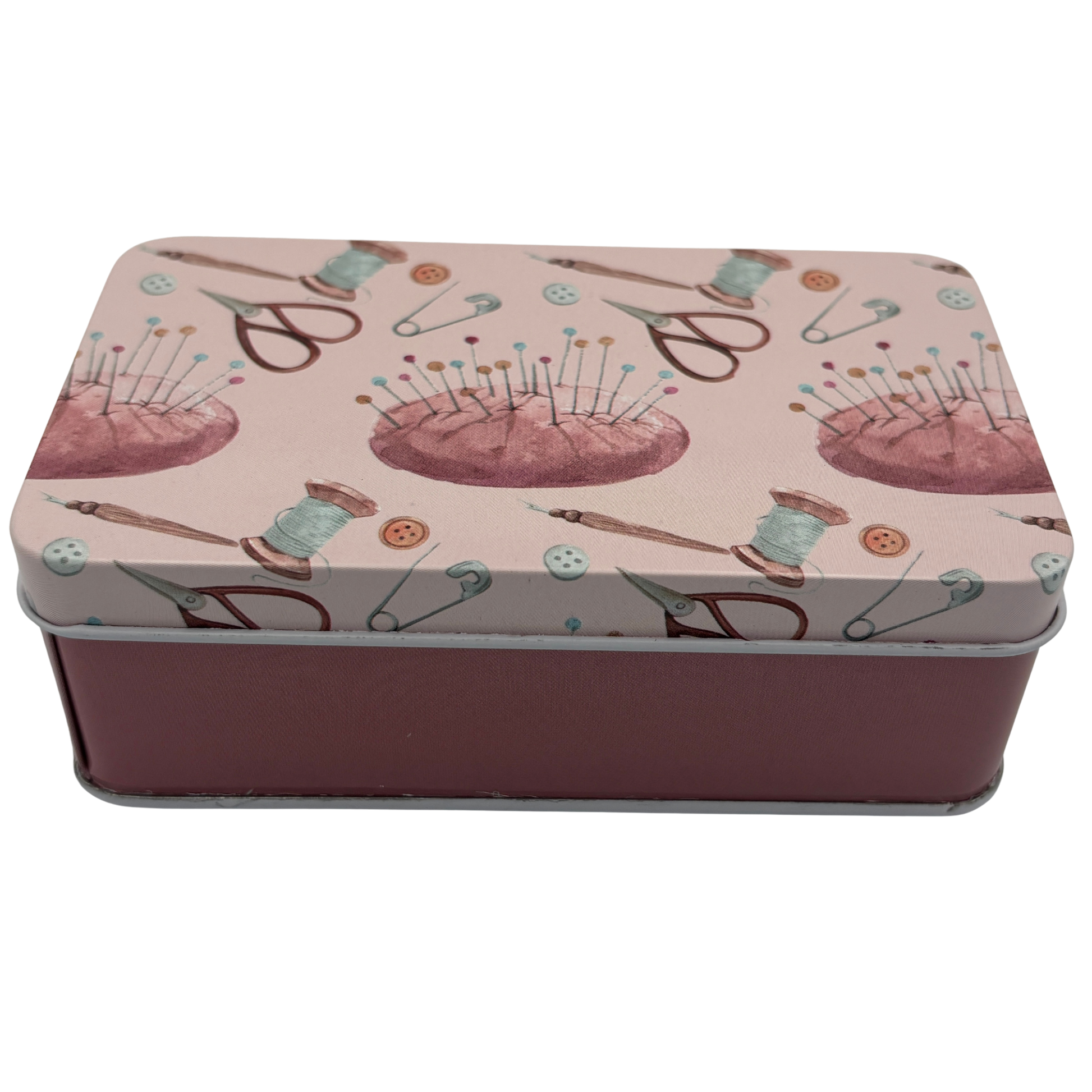 Rectangular tin box with sewing-themed design on a white background