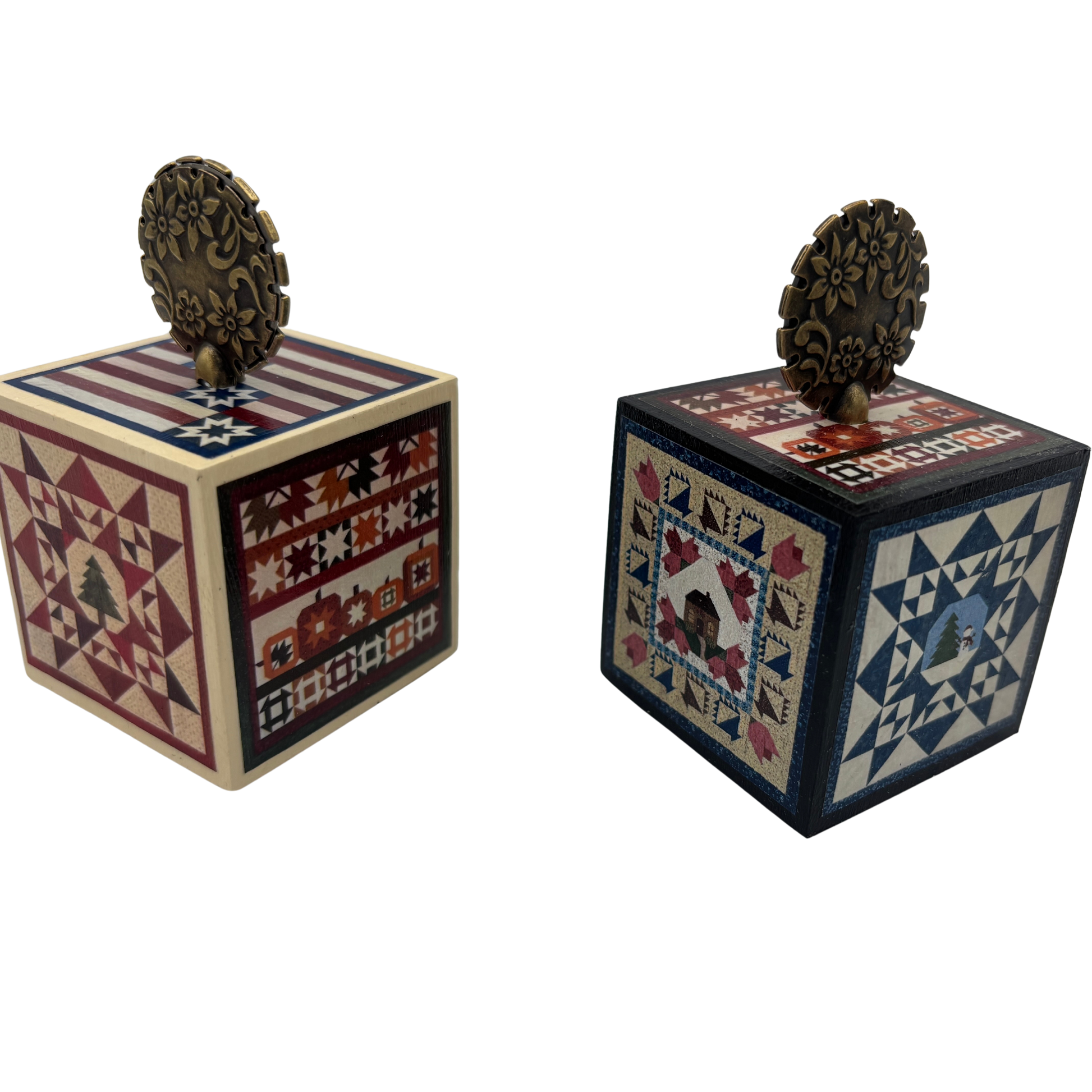Two decorative wooden cubes with quilt-style patterns on a white background