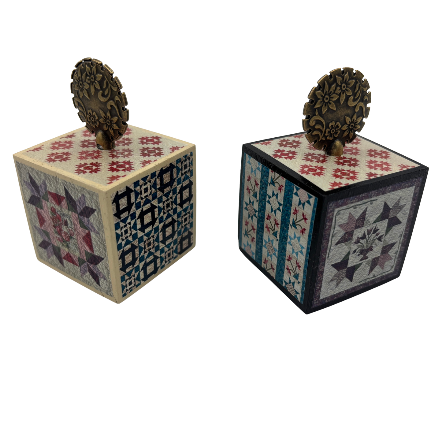 Two decorative wooden cubes with intricate patterns on a white background