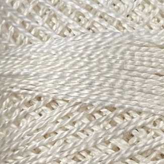 Close-up of white yarn with a textured pattern