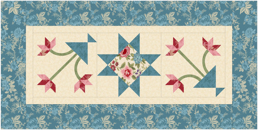 Table runner pattern with floral design and blue star shapes on a blue and white background