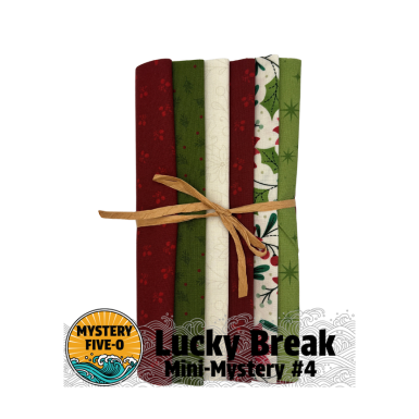Set of four fabric strips tied with a bow, featuring Christmas-themed patterns, on a white background. Brand 'Mystery Five-O' and 'Lucky Break' text visible.