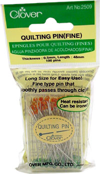 Package of quilting pins with a green label and white background