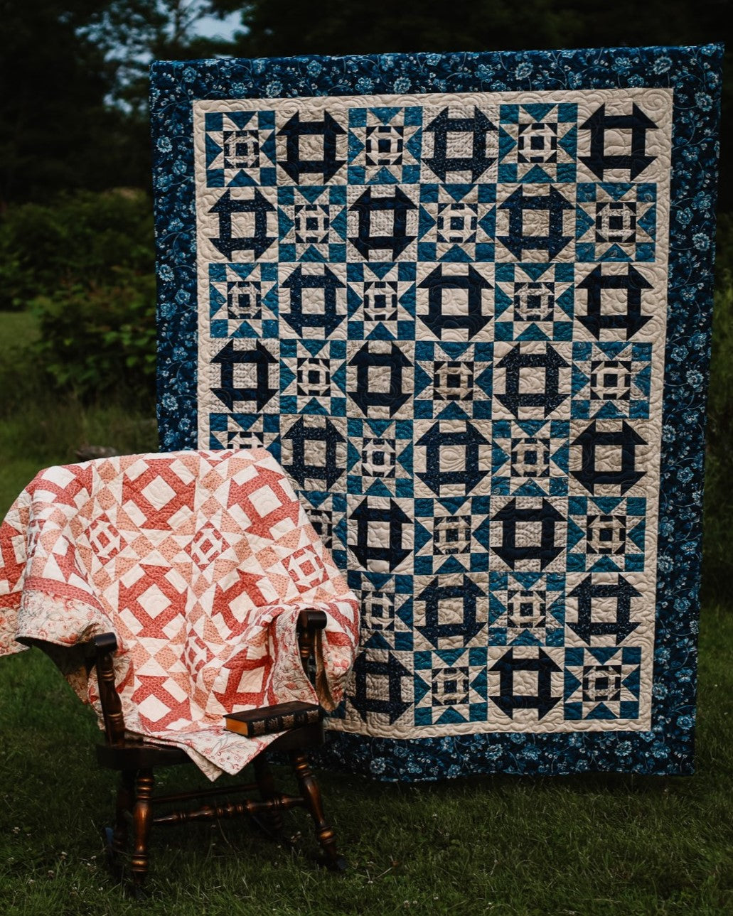 Quilt with geometric pattern draped over a chair outdoors