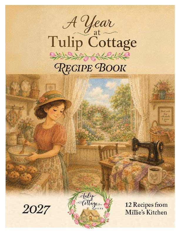 Front cover of the book 'A Year at Tulip Cottage Recipe Book' showing a vintage-style illustration of a woman mixing ingredients in a cozy kitchen, with a window view of a garden, sewing machine, flowers, and the text '2027' and '12 Recipes from Millie's Kitchen'.