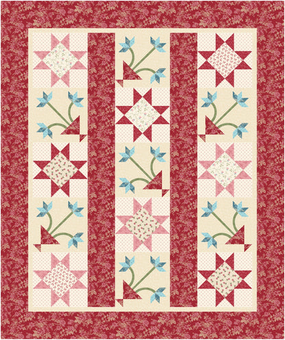 Quilt with star and floral patterns on a red background