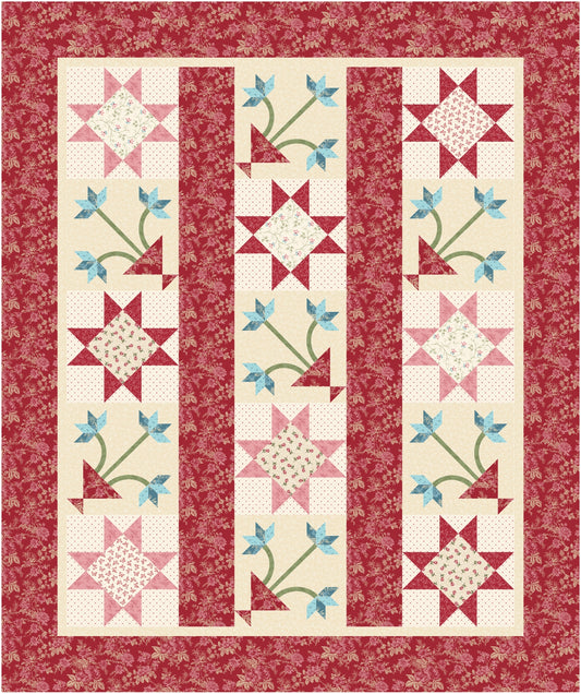 Quilt with star and floral patterns on a red background
